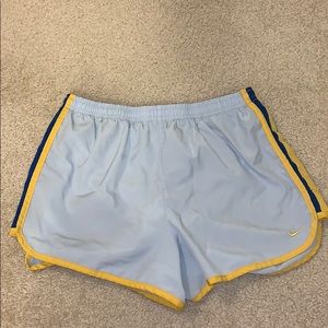 Nike running shorts. Light blue and yellow